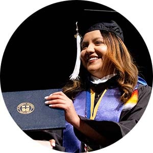 woman graduate accepting diploma